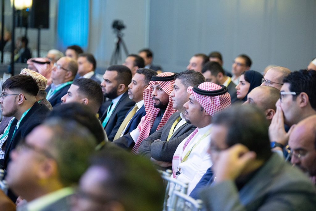 Guests listen to a presentation being delivered at the Umrah+ Connect event on Sunday. (Umrah+ Connect)